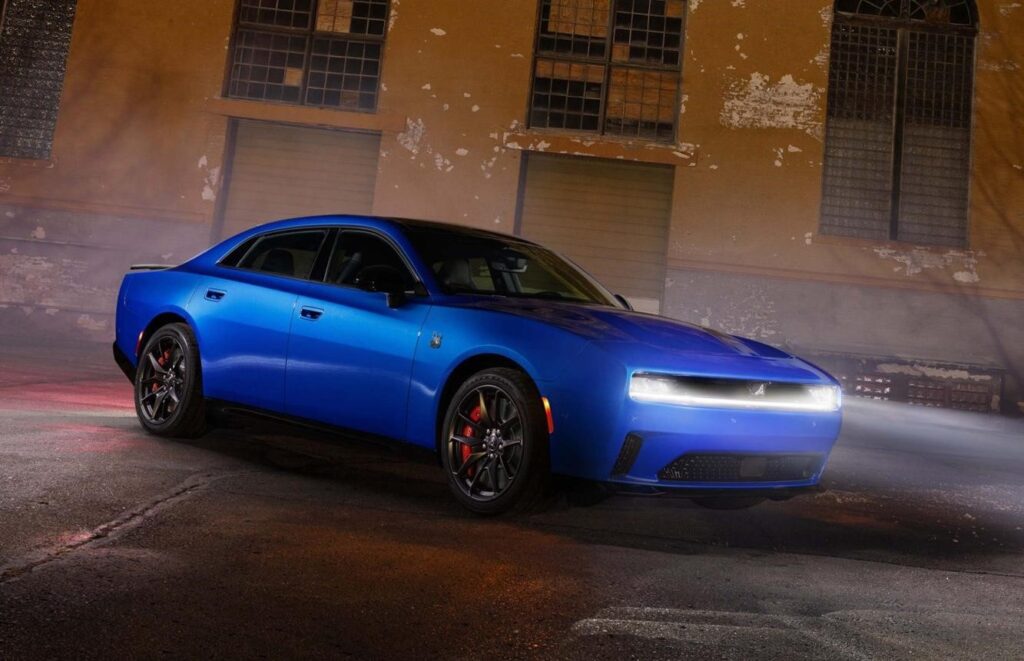 car comeback 2026 US modern muscle cars lineup sunset city background